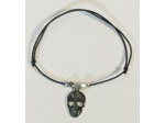 Bracelet élastique argenté/noir/tête de mort