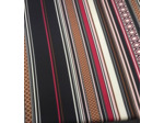 Tissu rayé rouge, rose... sur fond noir