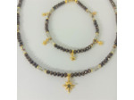 Parure en perles facettées marron/beige et ses étoiles dorées