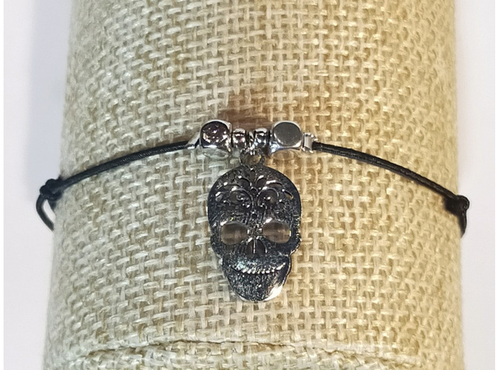 Bracelet élastique argenté/noir/tête de mort