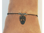 Bracelet élastique argenté/noir/tête de mort