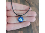 Pendentif œil porte bonheur sur cordon noir