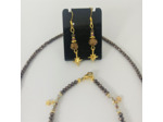 Parure en perles facettées marron/beige et ses étoiles dorées